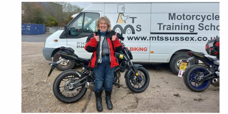 Delighted Debbie off to ride her own bike!